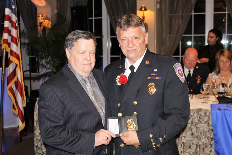LFD Chief McDermott presented with ex badge by mayor May2016