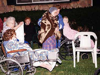 Nursing home residents wait outside early this morning.